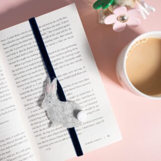 Rabbit stretchy bookmark, rabbit is grey felt with a white pom pom tail, I have hand embroidered an eye, nose and whiskers