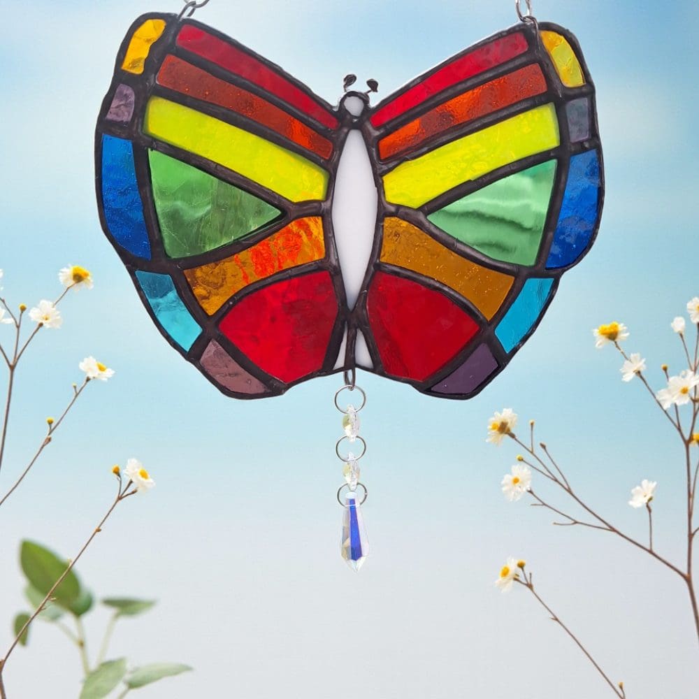 Handmade stained glass butterfly suncatcher with crystal prism creating dancing rainbows in sunlight window hanging decor 18 cm wide