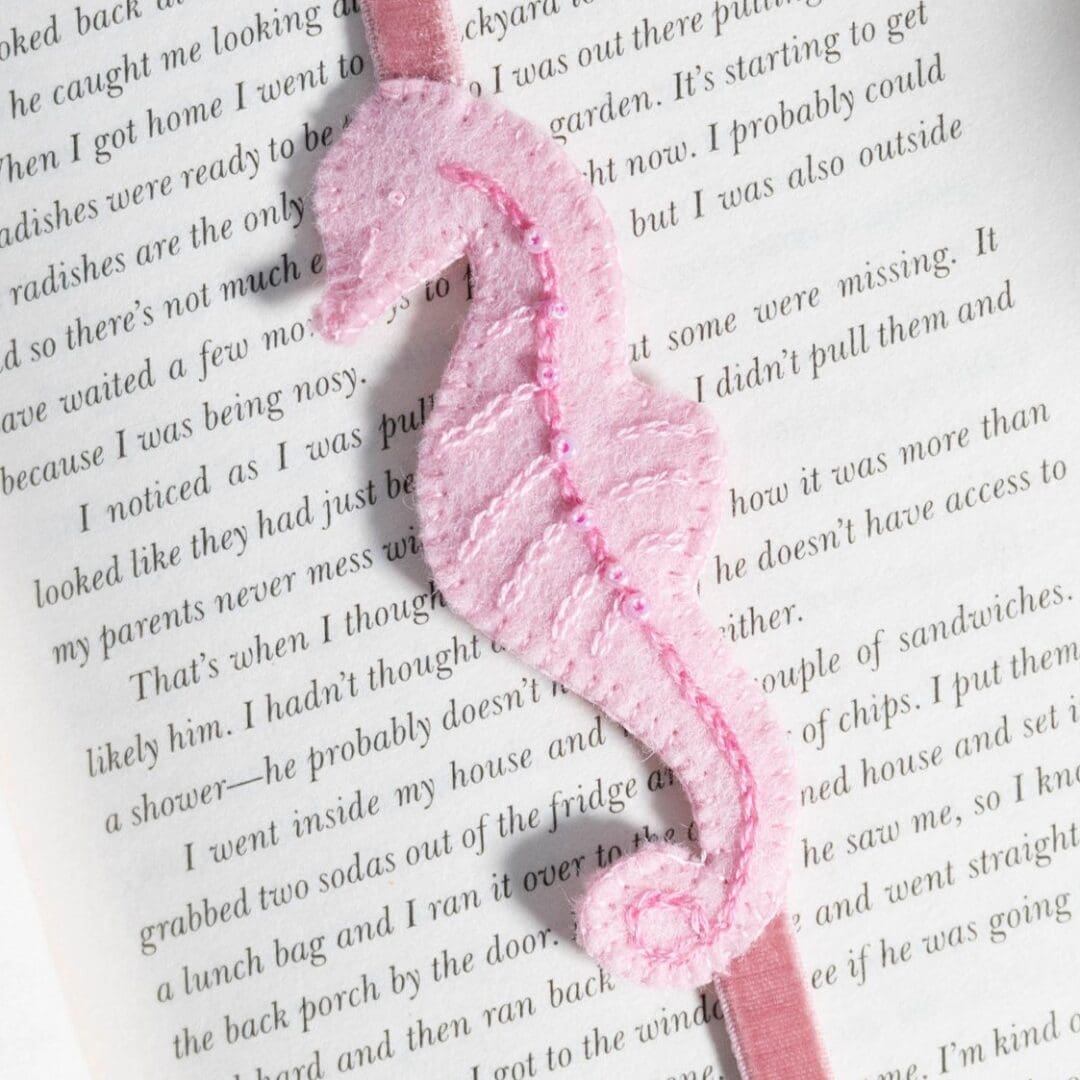 Close up of the pink felt seahorse showing the beading and detailed stitches