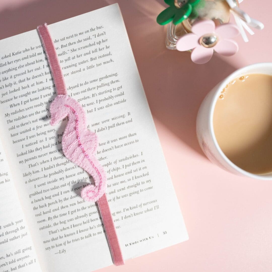 Pretty pink felt seahorse adorned with tiny beads and stitches on a pink velvet elasticated ribbon to hold your place in a book