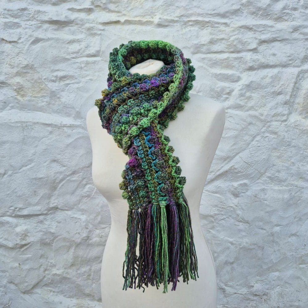 vibrant crocheted scarf purples greens