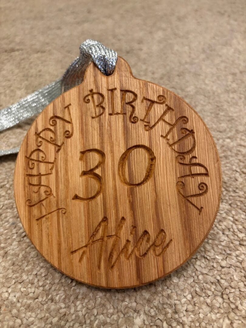 Solid Oak birthday medal.