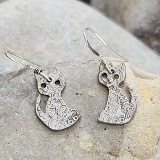 Cat-earrings-pierced-from-sixpence-coins