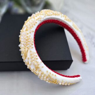 White satin bridal headband with gold embroidery and AB lustre beads.