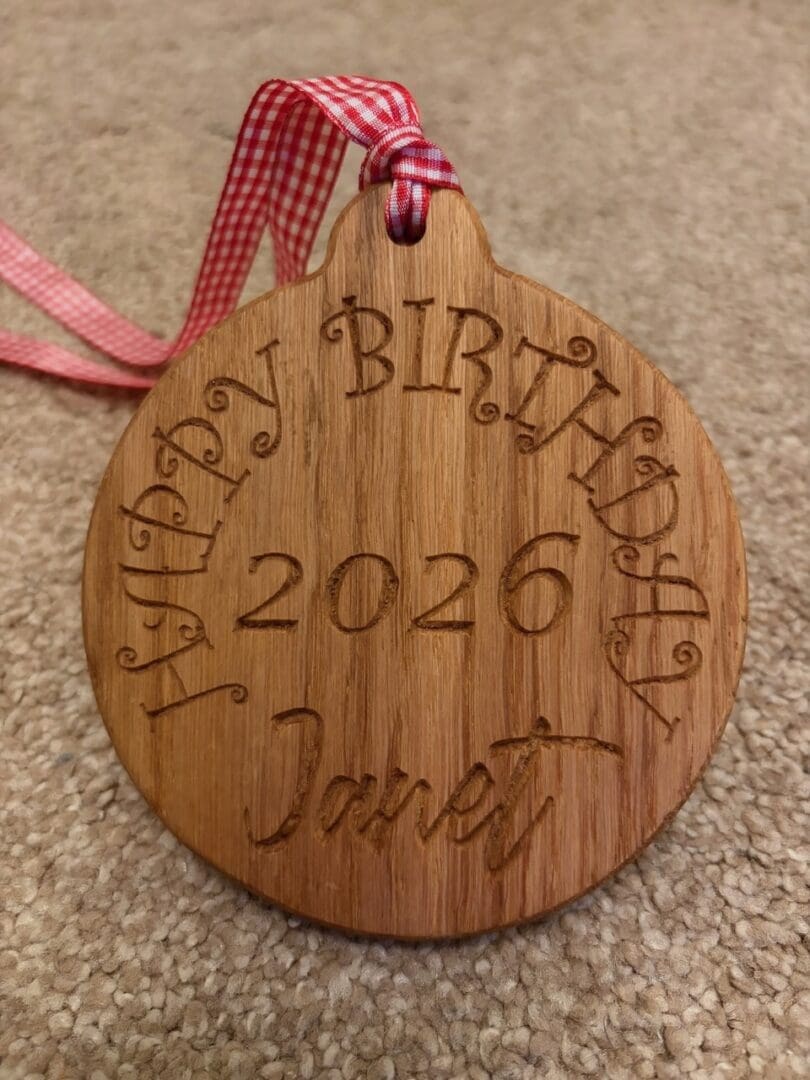 Solid Oak birthday medal.