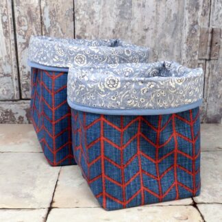 Geometric storage cubes in a red and blue fabric.