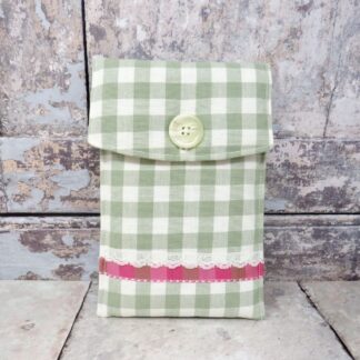 A green gingham kindle case with a ribbon and lace trim.