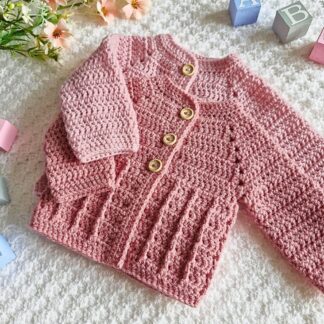 Handmade textured crochet baby cardigan in a soft pink and pale rose with a classic button-down front.