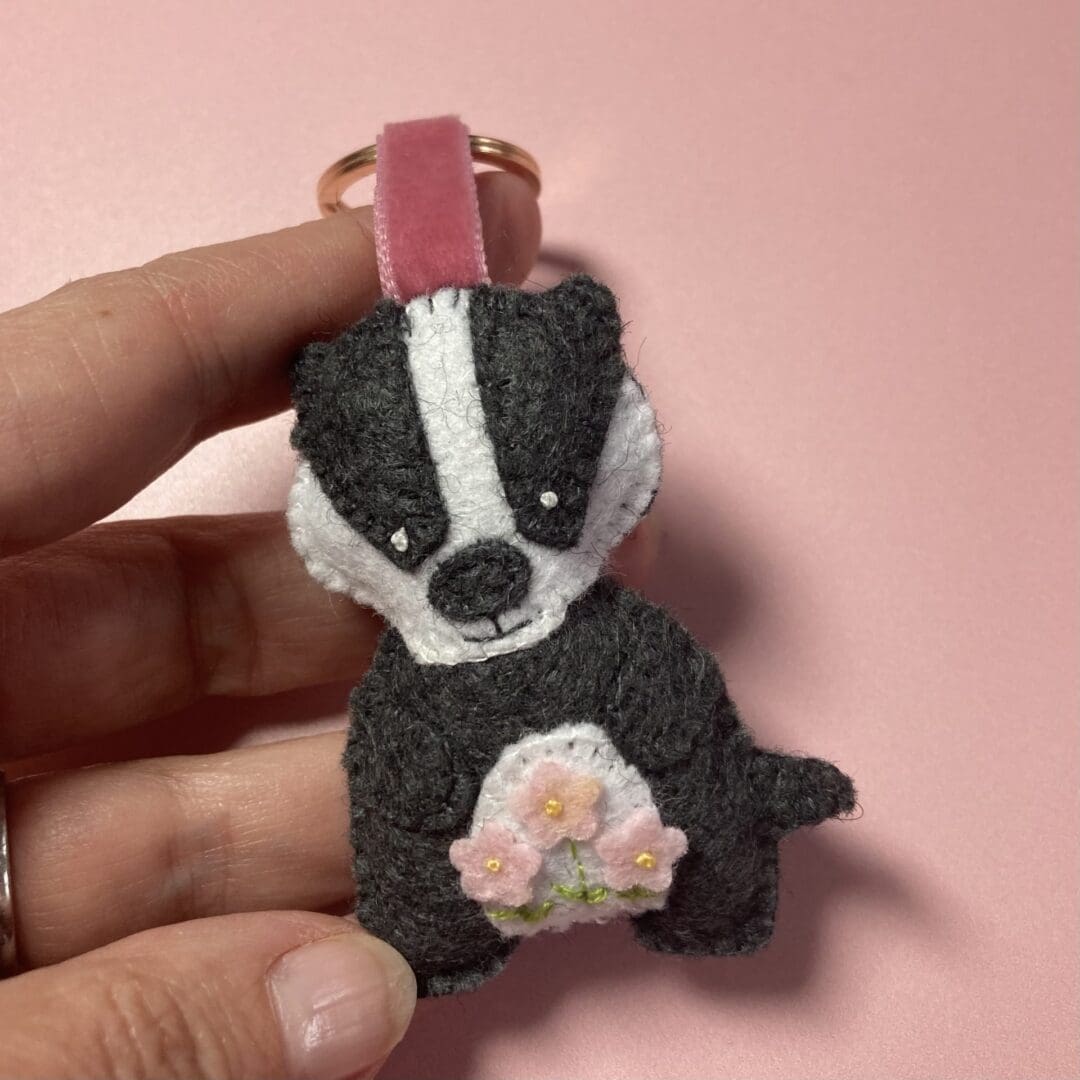 Me holding a badger keyring