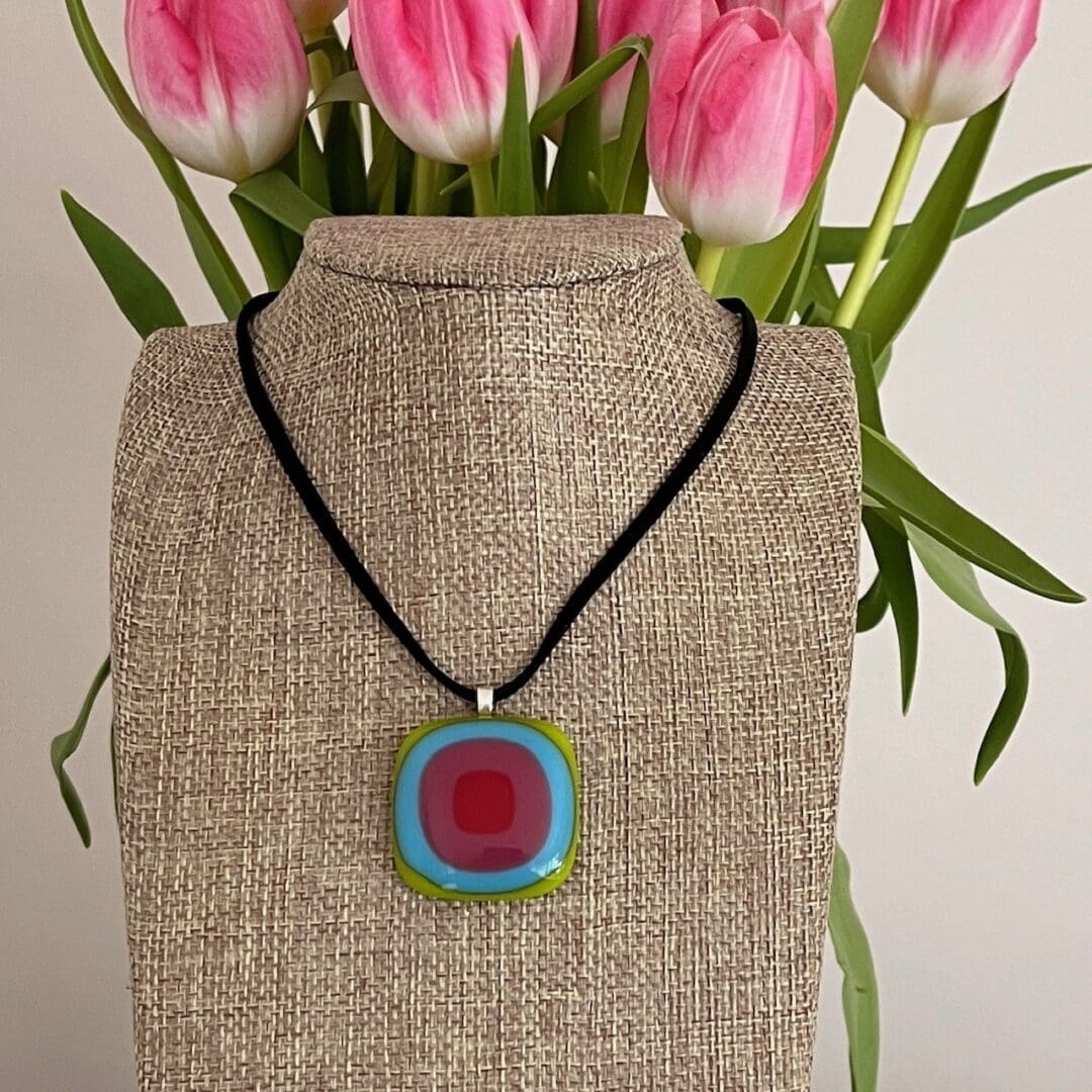 Large chunky fused glass pendant in bright square colours of the rainbow