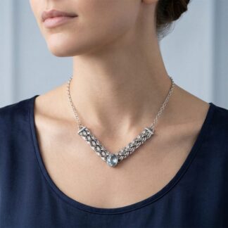 Sterling silver basket weave necklace with sky blue topaz on model