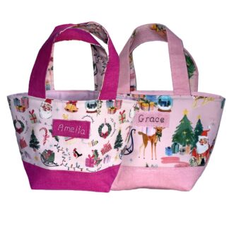toy tote bags in different shades of pink handmade in a Christmas themed print