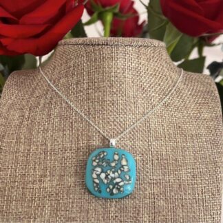 Duck egg or turquoise blue pendant with cream sprinkles
