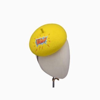 yellow blocked felt beret percher hat with fun comic style POW applique