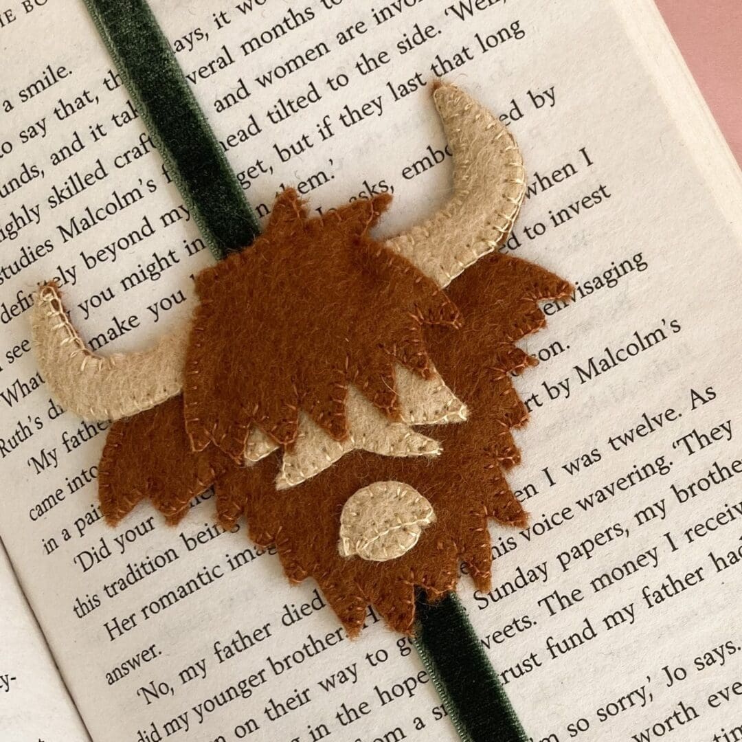 Close up of the handmade felt scottish cow with horns
