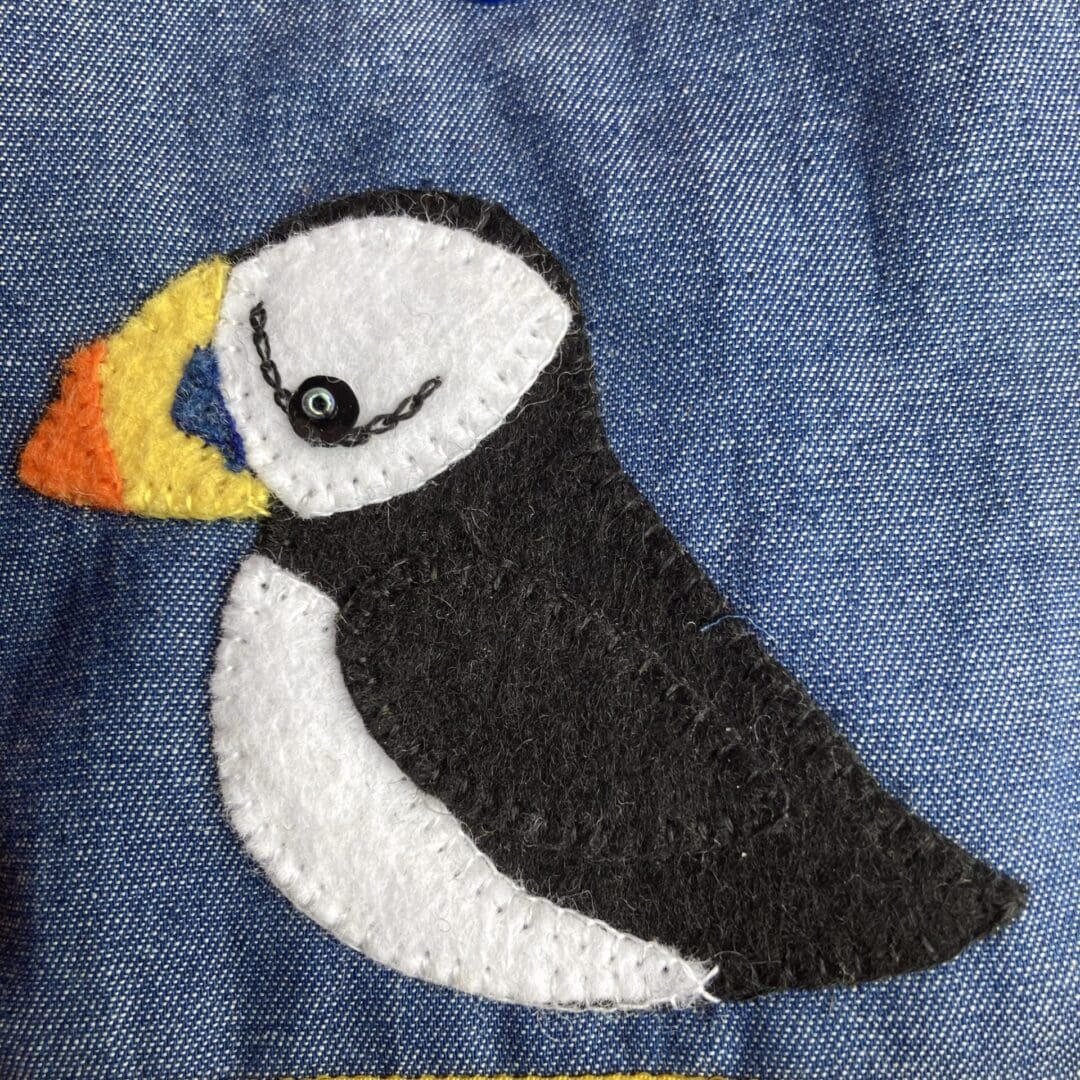 Close up of felt puffin on the glasses case