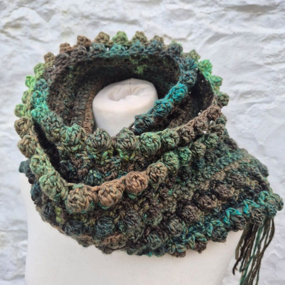crocheted scarf in greens