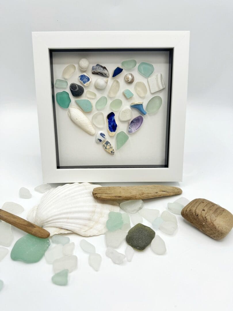 blue and white mosaic heart made from beach finds