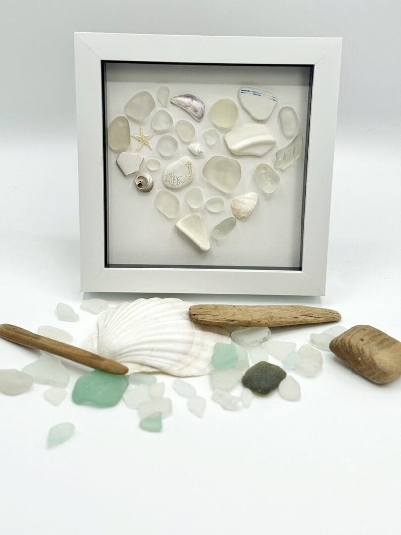 white mosaic heart made from beach finds
