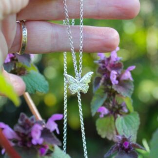 Handmade Sterling silver butterfly pendant held on silver belcher chain