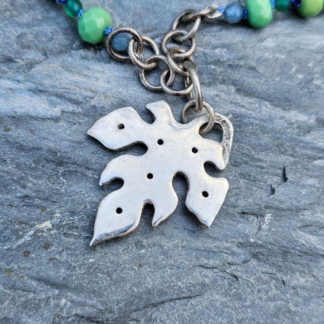 Silver leaf pendant set with lab emerald, topaz, tsavorite and spinel, back of pendant, Isobel Kelly Jewellery