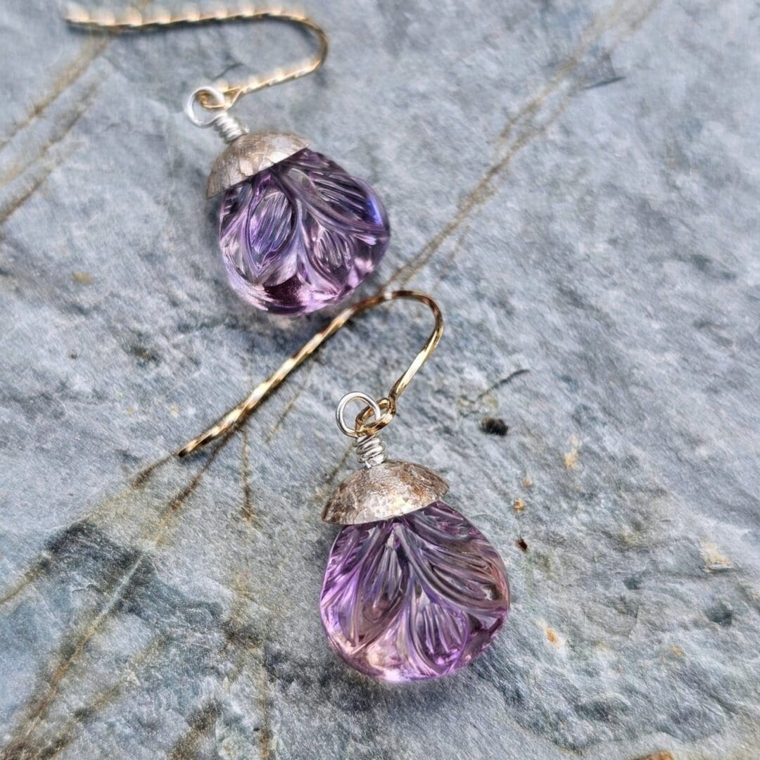 Pair of carved ametrine teardrop earrings with leaf motifs, finished with aged sterling silver and rolled gold twist hooks, Isobel Kelly Jewellery.