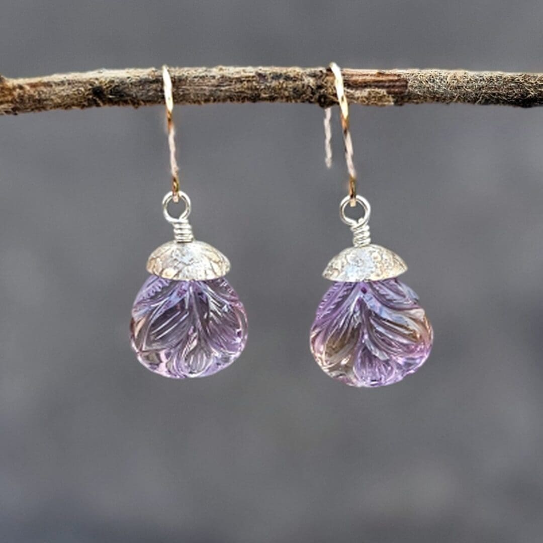 Pair of carved ametrine teardrop earrings with leaf motifs, finished with aged sterling silver and rolled gold twist hooks, hanging, Isobel Kelly Jewellery.
