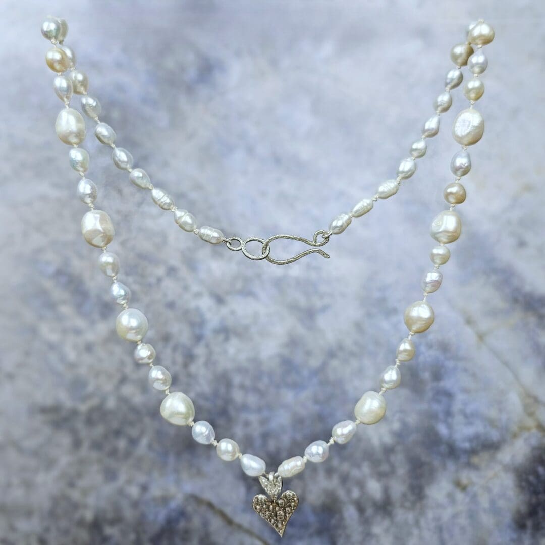 White baroque pearl knotted silk strand with silver heart pendant - Image 2