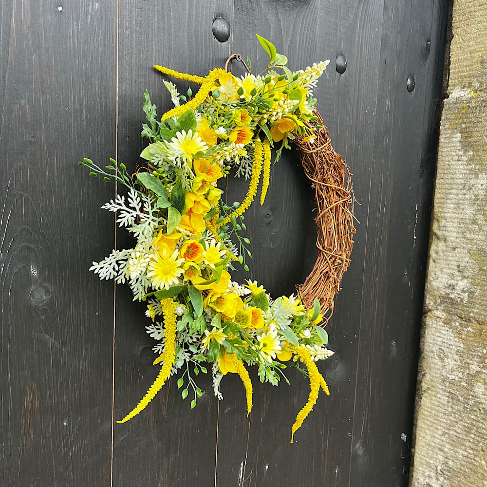 Yellow artificial front door wreath