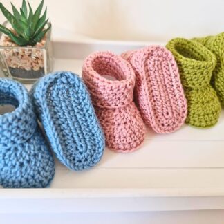 pink, blue and green crochet newborn baby booties made with 100% British wool