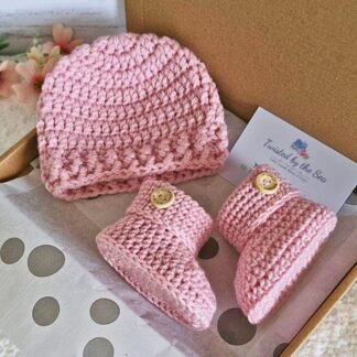 crochet baby gift set in powder pink, with matching hat and booties