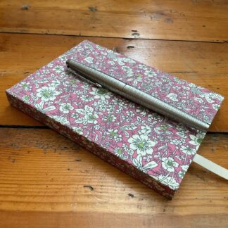 Small A6 handmade notebook with lined paper covered in floral fabri