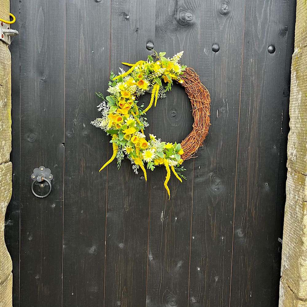 Yellow artificial front door wreath