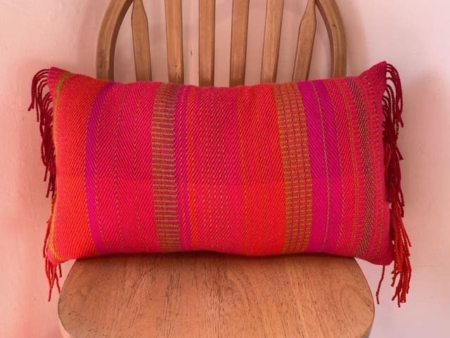 Long cushion with fringing, hand crafted from British wool
