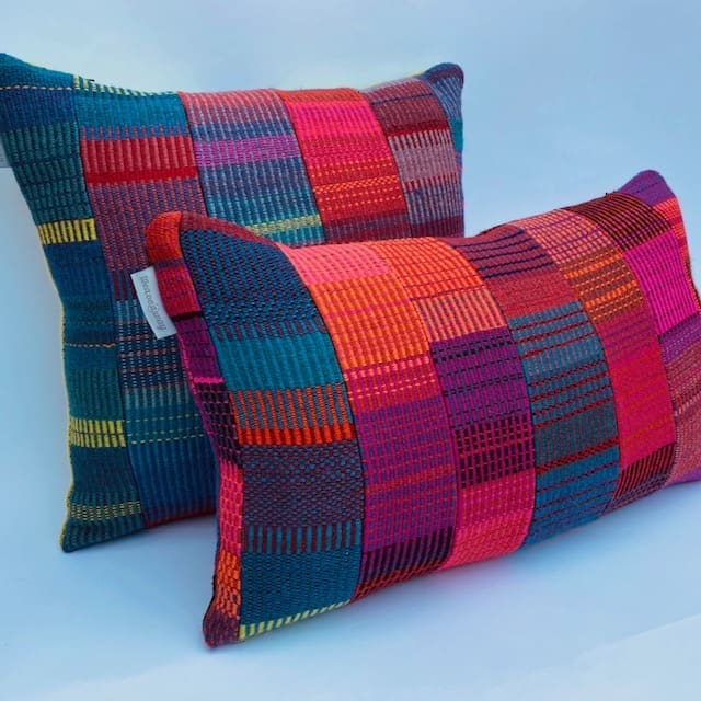 A colourful, patchwork design handwoven wool cushion - Image 4