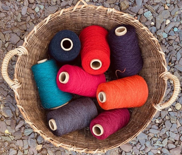 A colourful, patchwork design handwoven wool cushion - Image 5