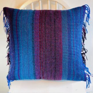 Unique handwoven wool cushion in beautiful blues.