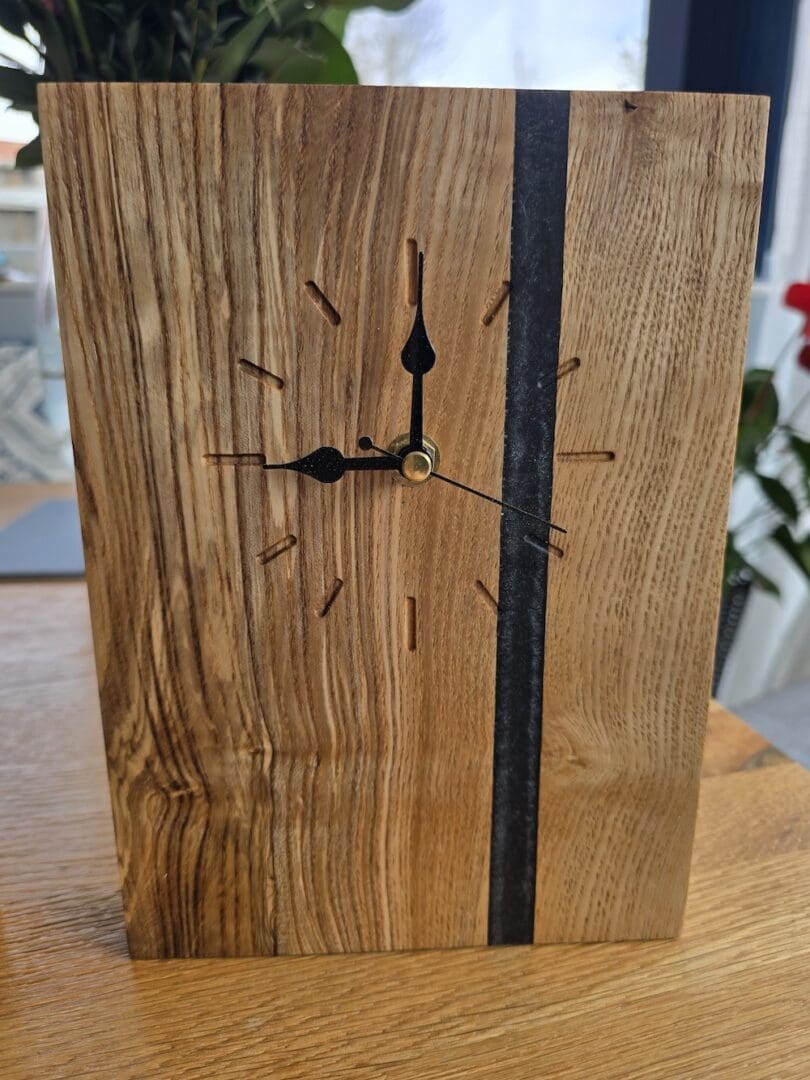 European walnut mantle clock with vertical resin seam and matte finish, minimal design with angled base