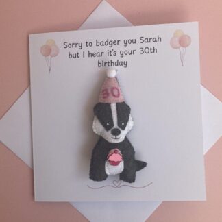 Badger birthday card with removable handmade felt grey and white badger hanging decoration. The card reads Sorry to badger you [insert name] but I hear it's your [insert age] birthday