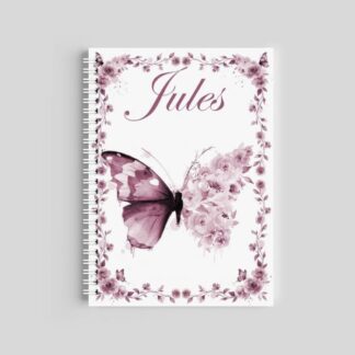 A spiral-bound notebook with a white cover featuring a large purple butterfly and soft watercolor flowers. The name "Mya" is printed in a clean black font at the bottom.