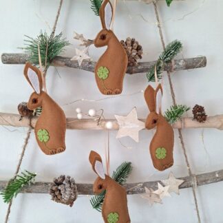 Lucky rabbit felt hanging decorations with green clover leaf motifs by lyndawilcansew hung on a rustic twig tree