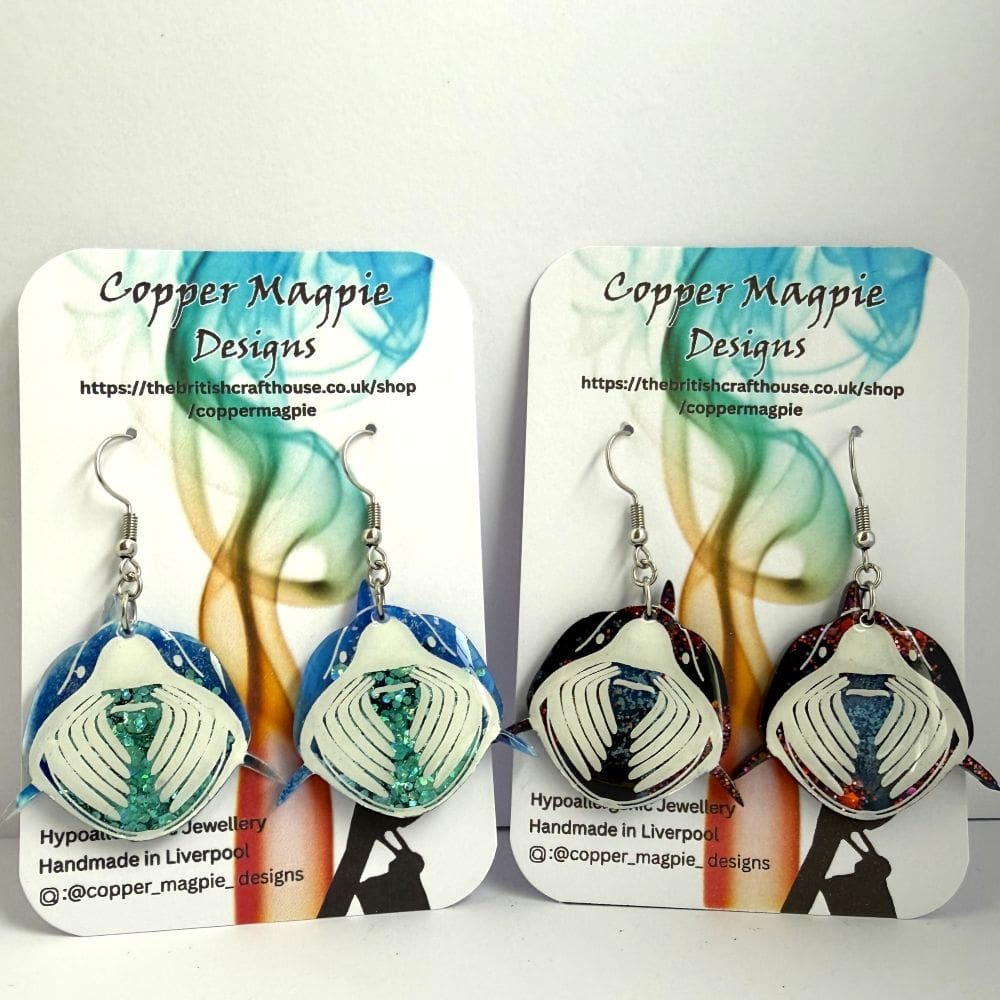 Basking shark earrings by Copper Magpie Designs, displayed on branded cards.