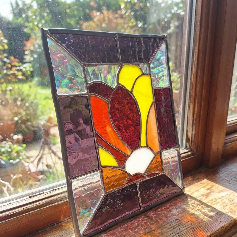 Art Nouveau style stained glass with floral motif