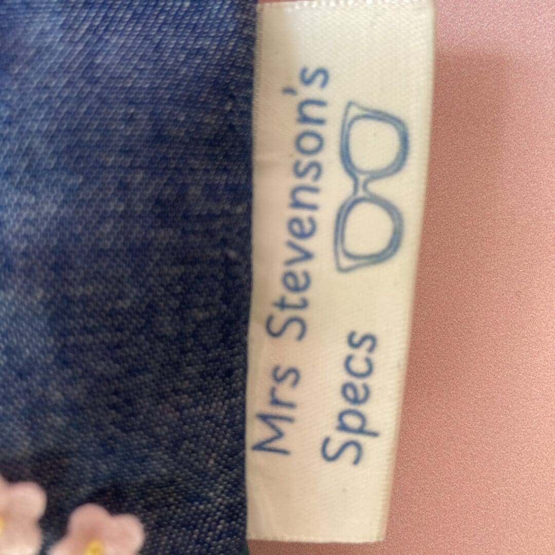 I can add a personalised seam tag to your glasses case, this one reads 'Mrs Stevenson's Specs' and has an image of a pair of glasses.