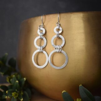 sterling silver dangle earrings with three circles of increasing size