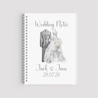 A spiral-bound A5 notebook with an elegant monochrome sketch of a wedding dress on a mannequin and a suit. Text at the top reads "Wedding Notes" and the bottom is personalised with "Jack & Jane 28.07.26"