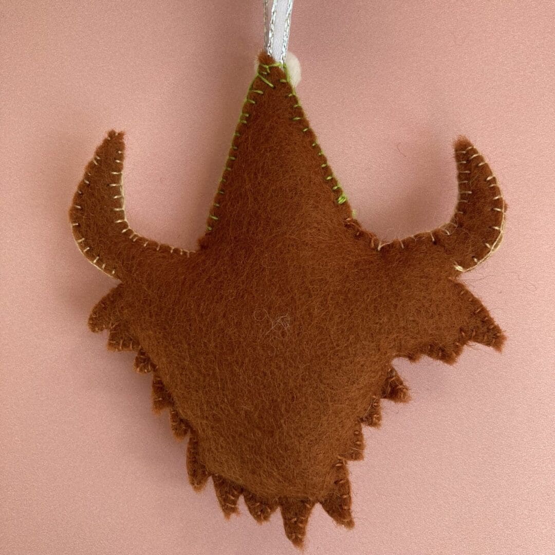 The back of the highland cow is russet brown
