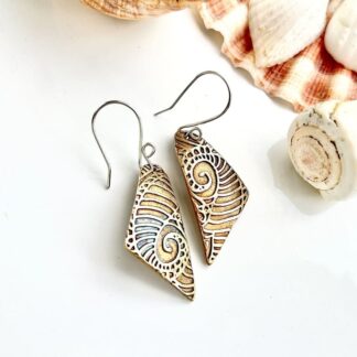 A pair of bronze drop earrings, handcrafted, textired with a seascape pattern