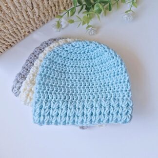 stack of 3 puff stitch baby hats in blue, cream and silver