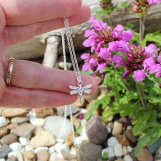 Sterling silver dragonfly pendant held on sterling silver oval belcher chain
